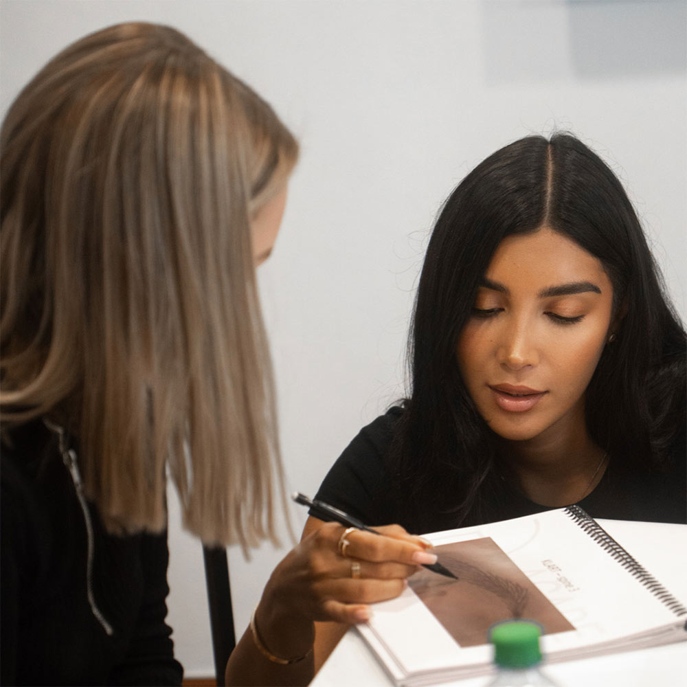 Woman training in microblading